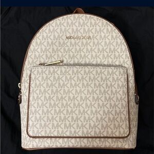 Women’s Michael kors white and brown back pack used normal wear